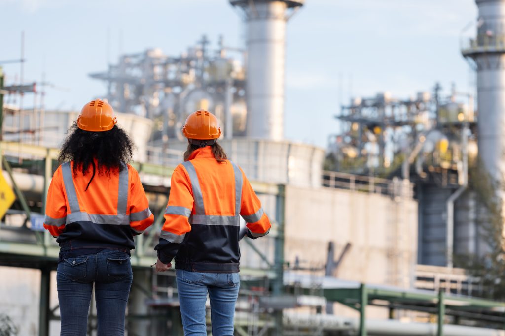 two-female-engineers-stand-at-an-industrial-plant-2026-03-25-04-12-14-utc